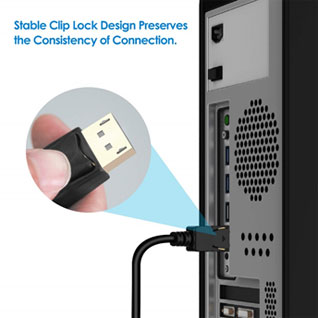 A DP cable plugged into the rear I/O panel of a desktop, with a close up view of the latching design